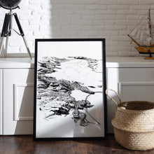 Load image into Gallery viewer, A black and white illustrated map of Port Chalmers laid out on white paper within a black frame, leaning against a white wall shelving seat and wooden flooring.