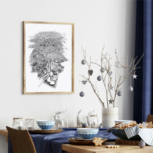 Load image into Gallery viewer, A black and white illustrated map of Melbourne City laid out on white paper within a wooden frame, against a white wall, above a table setting.