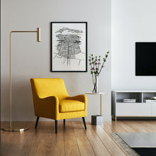 Load image into Gallery viewer, A black and white illustrated print of Auckland City laid out on white paper within a black frame hung on a wall above a seating area.