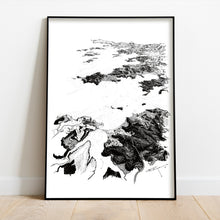 Load image into Gallery viewer, A black and white illustrated map of Bay of Islands laid out on white paper, framed in a black frame, leaning on a white wall and wooden flooring.