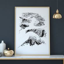 Load image into Gallery viewer, A black and white illustrated print of Havelock laid out on white paper within a thin gold frame against a navy wall, sitting on a marble top console with gold metal.