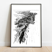 Load image into Gallery viewer, A black and white illustrated map of Piha laid out on white paper, framed in a black frame, leaning on a white wall and wooden flooring.