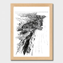 Load image into Gallery viewer, A black and white illustrated map of Piha laid out on white paper within a light wooden frame, against a white wall.