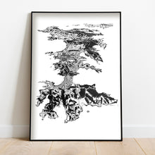 Load image into Gallery viewer, A black and white illustrated print of Waiheke Island laid out on white paper, framed in a black frame, leaning on a white wall and wooden flooring.