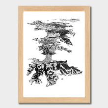 Load image into Gallery viewer, A black and white illustrated print of Waiheke Island laid out on white paper within a light wooden frame, against a white wall.