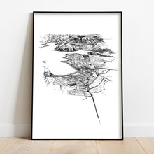 Load image into Gallery viewer, A black and white illustrated print of Wānaka laid out on white paper framed in a black frame leaning on a white wall and wooden flooring.