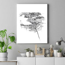 Load image into Gallery viewer, A black and white illustrated print of Wānaka on a canvas hanging on a grey wall above a while console with decor and a pot plant.