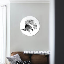 Load image into Gallery viewer, A round glass art piece with a black and white illustrated print of Queenstown, mounted on a wall.