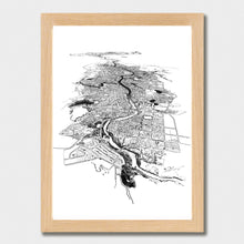 Load image into Gallery viewer, A black and white illustrated print of Hamilton laid out on white paper within a light wooden frame, against a white wall.